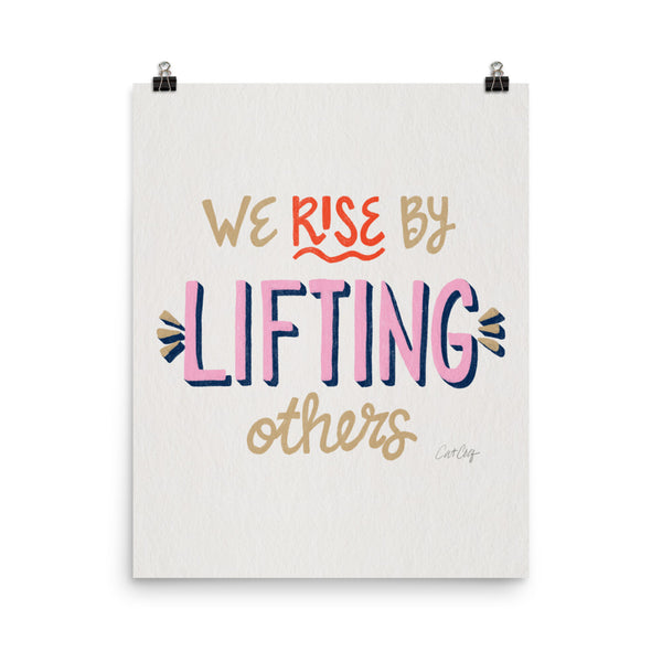 We Rise by Lifting Others - Coral Pink